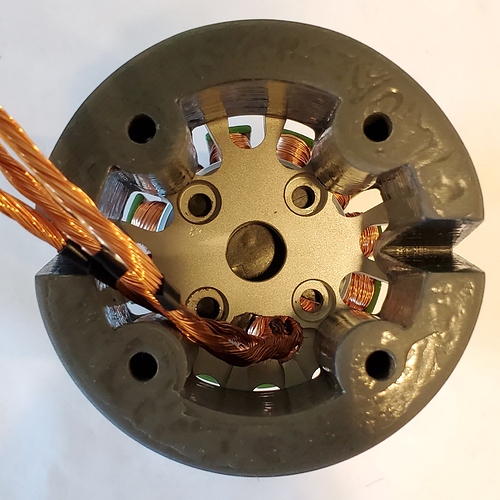 Top view of motor cap on stator with rear clamp